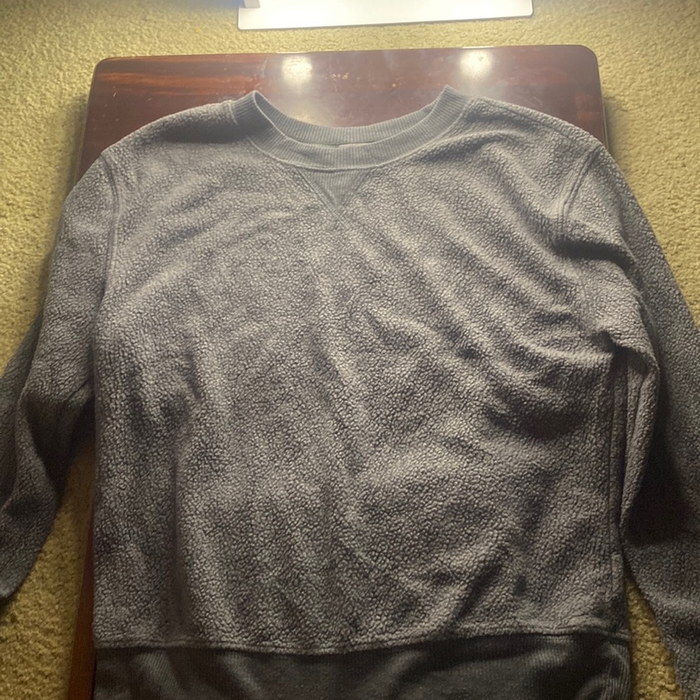 Dark grey sweater.
